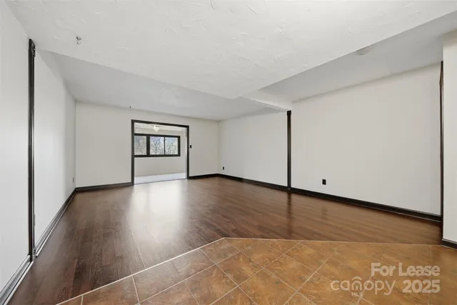 a view of a livingroom with wooden floor