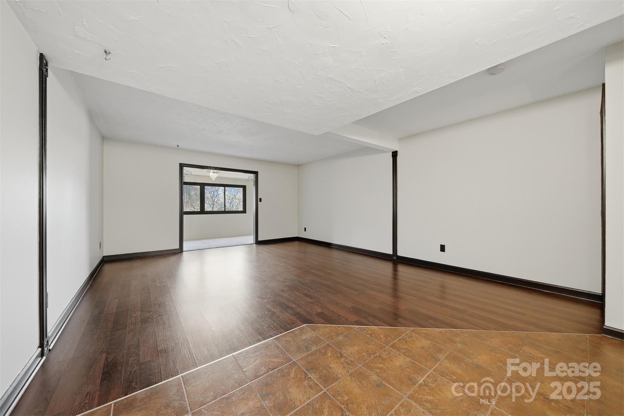 2705 North Center Street, Unit 78 Hickory, NC 28601 - Photo 4 of 17 a view of a livingroom with wooden floor
