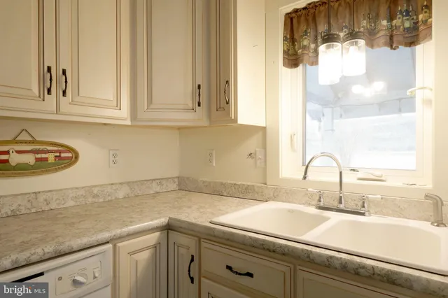 a kitchen with a sink and cabinets