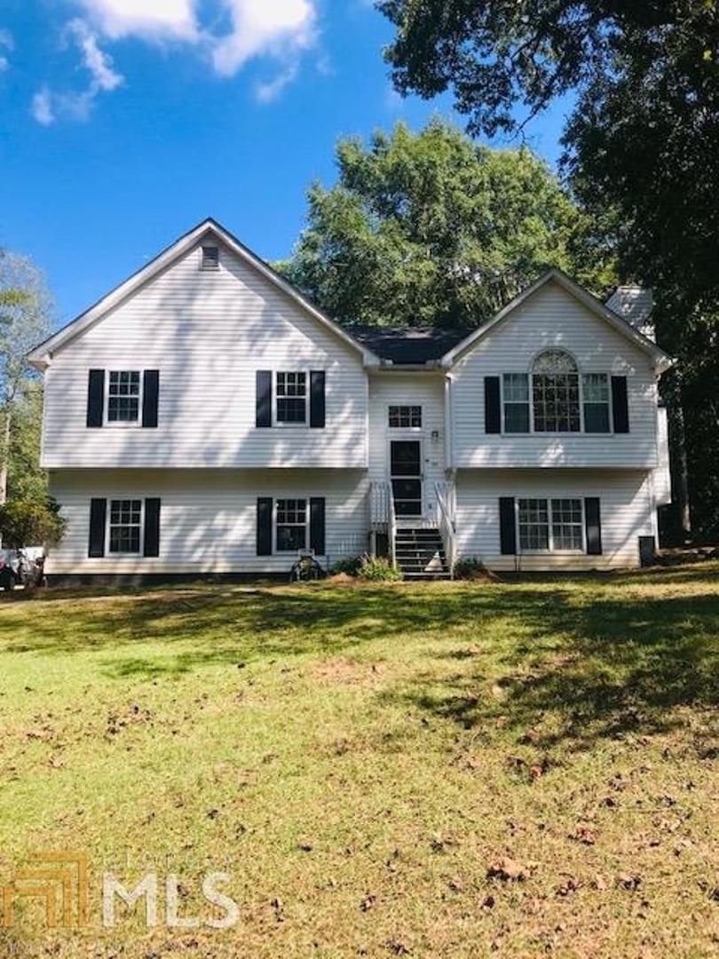 281 Astin Creek Road Villa Rica, GA 30180 - Photo 1 of 1 a front view of a house with a yard