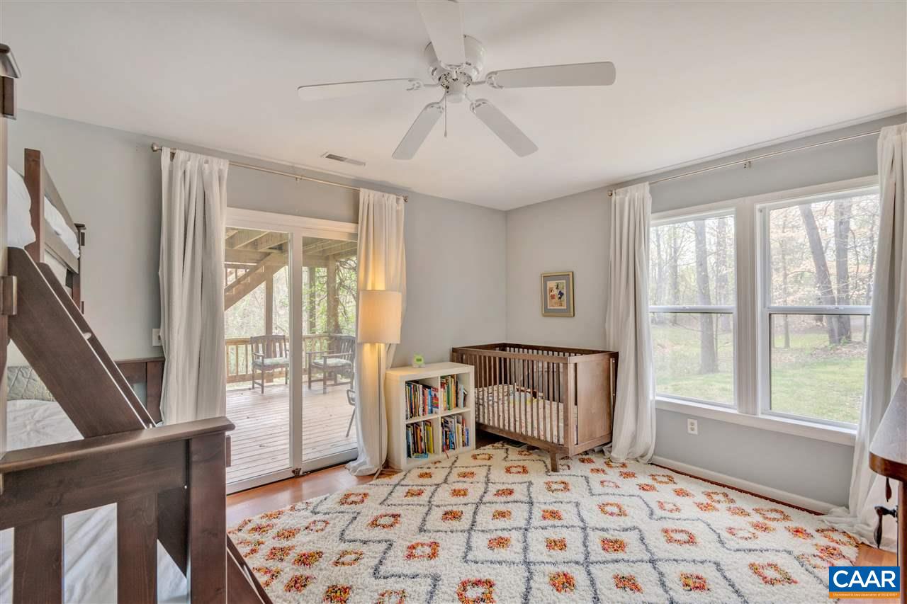 267 Turkey Ridge Road Charlottesville, VA 22903 - Photo 21 of 35 a bedroom with furniture and a window