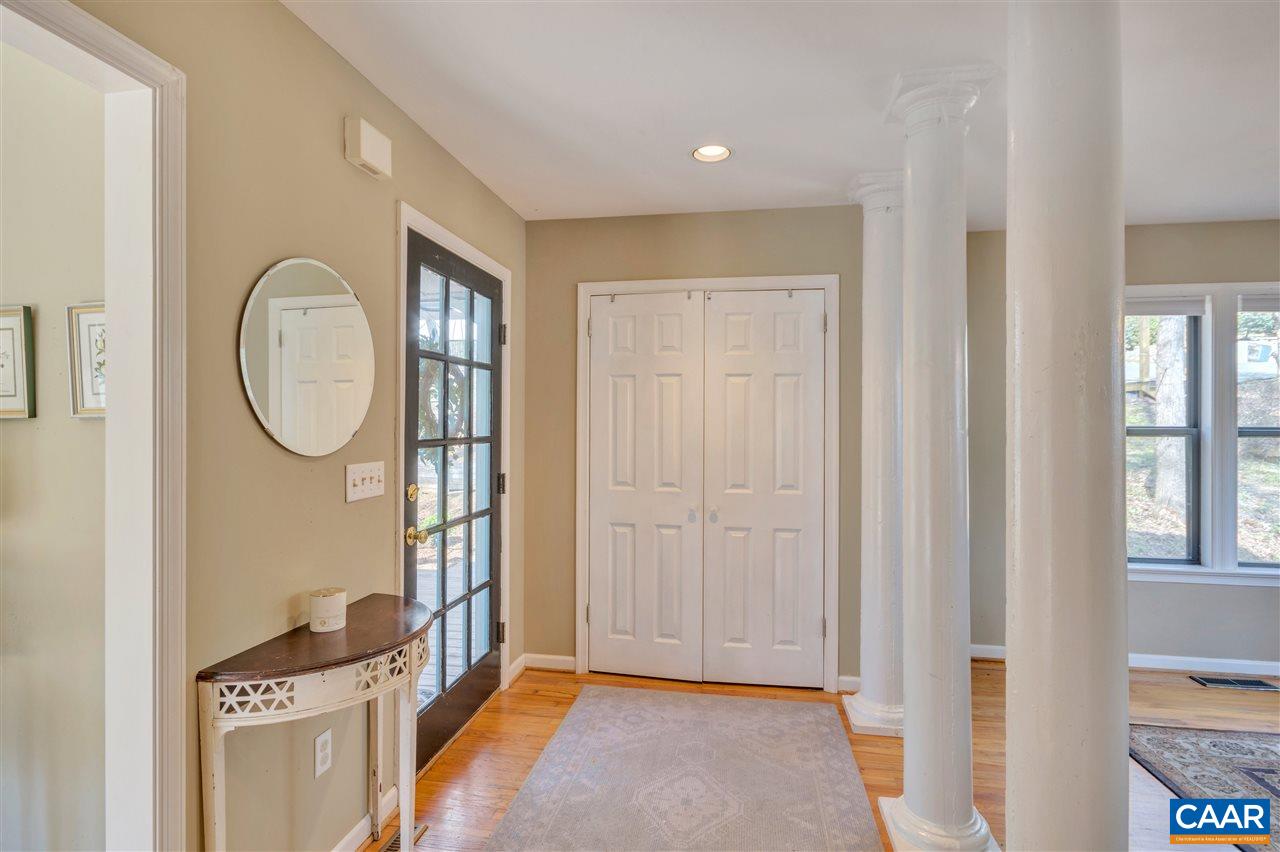 267 Turkey Ridge Road Charlottesville, VA 22903 - Photo 3 of 35 a view of an entryway with wooden floor and a livingroom