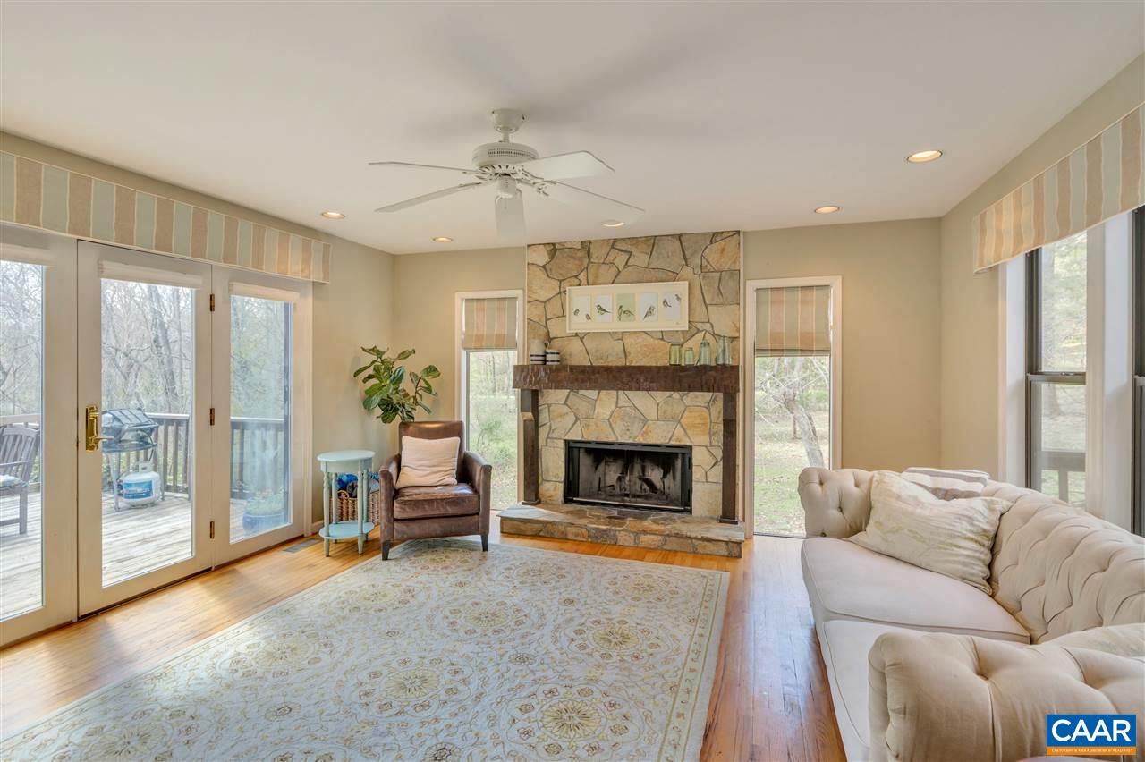 267 Turkey Ridge Road Charlottesville, VA 22903 - Photo 4 of 35 a living room with furniture and a fireplace