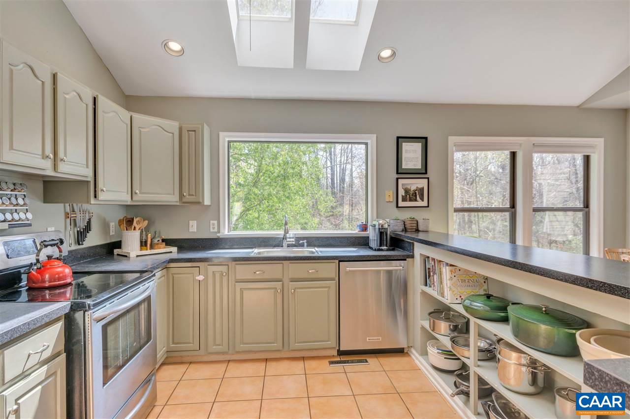 267 Turkey Ridge Road Charlottesville, VA 22903 - Photo 8 of 35 a kitchen with a sink stove and cabinets