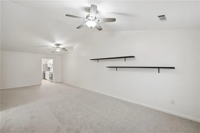 a view of a chandelier fan in a room