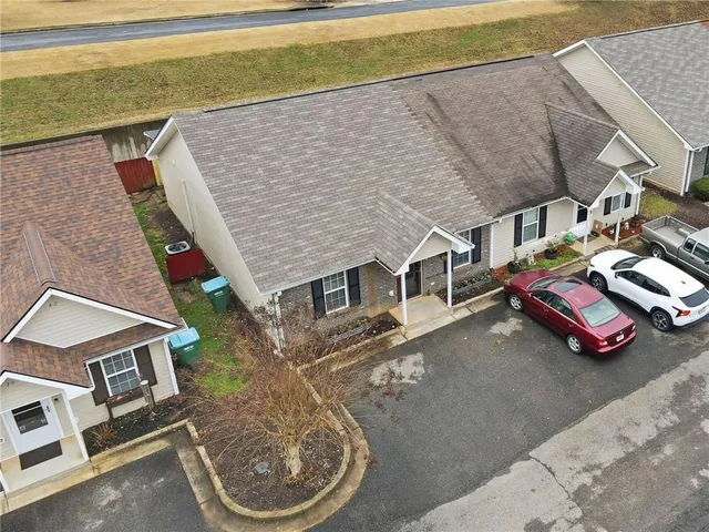 an aerial view of a house with a patio