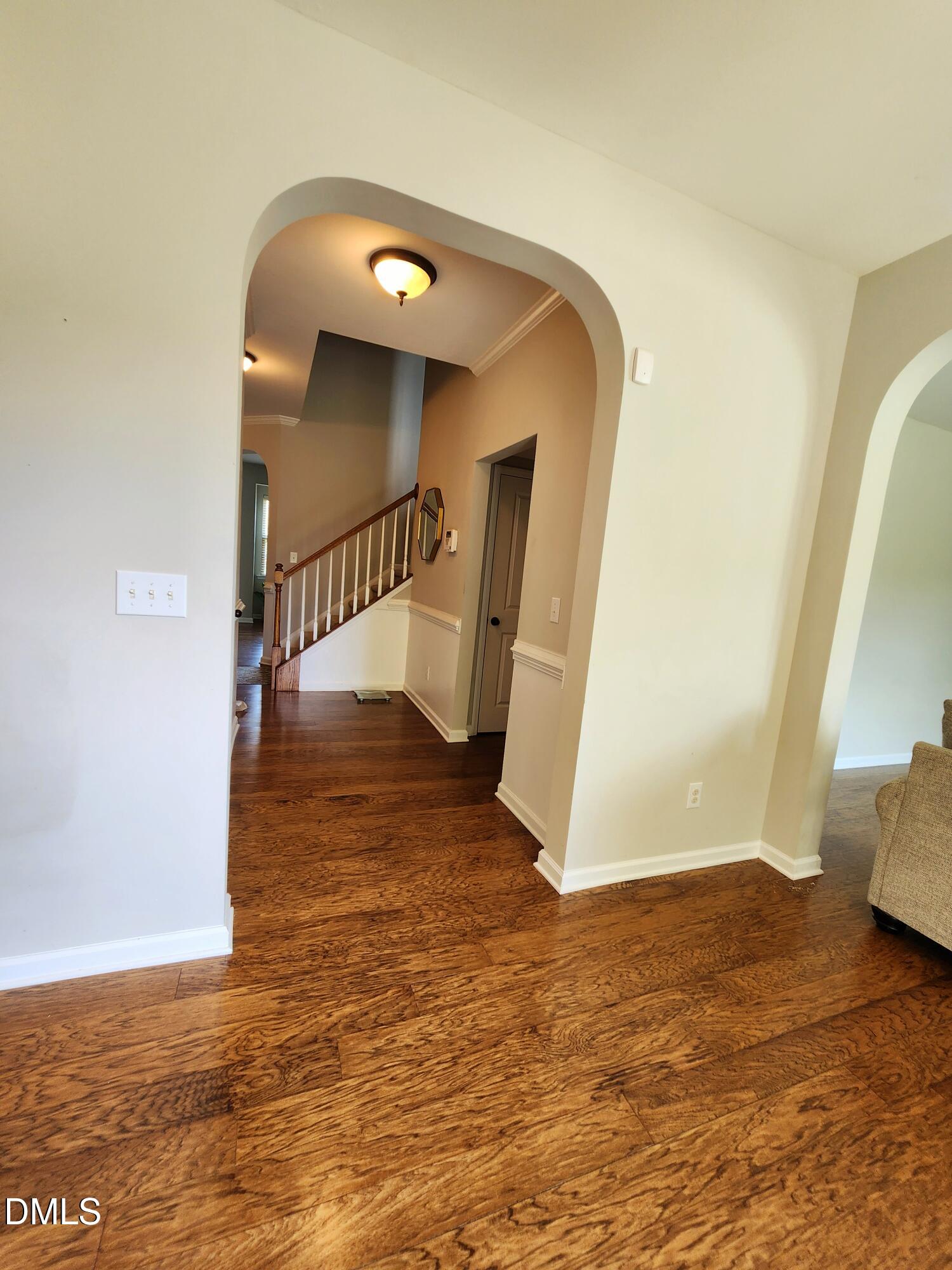 825 Wickham Ridge Road Apex, NC 27539 - Photo 11 of 31 a view of entryway and hall with wooden floor
