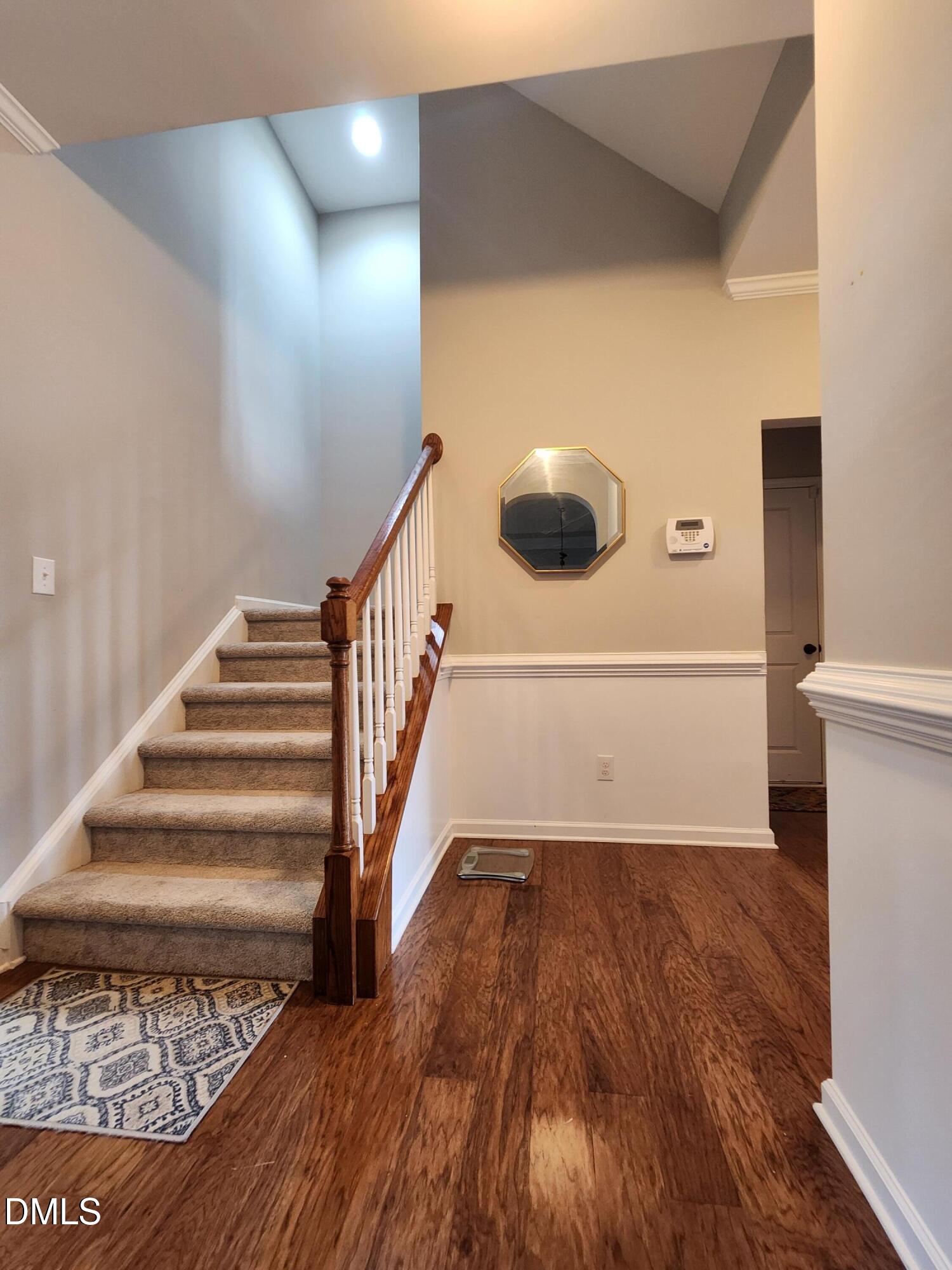 825 Wickham Ridge Road Apex, NC 27539 - Photo 15 of 31 a view of entryway and hall with wooden floor