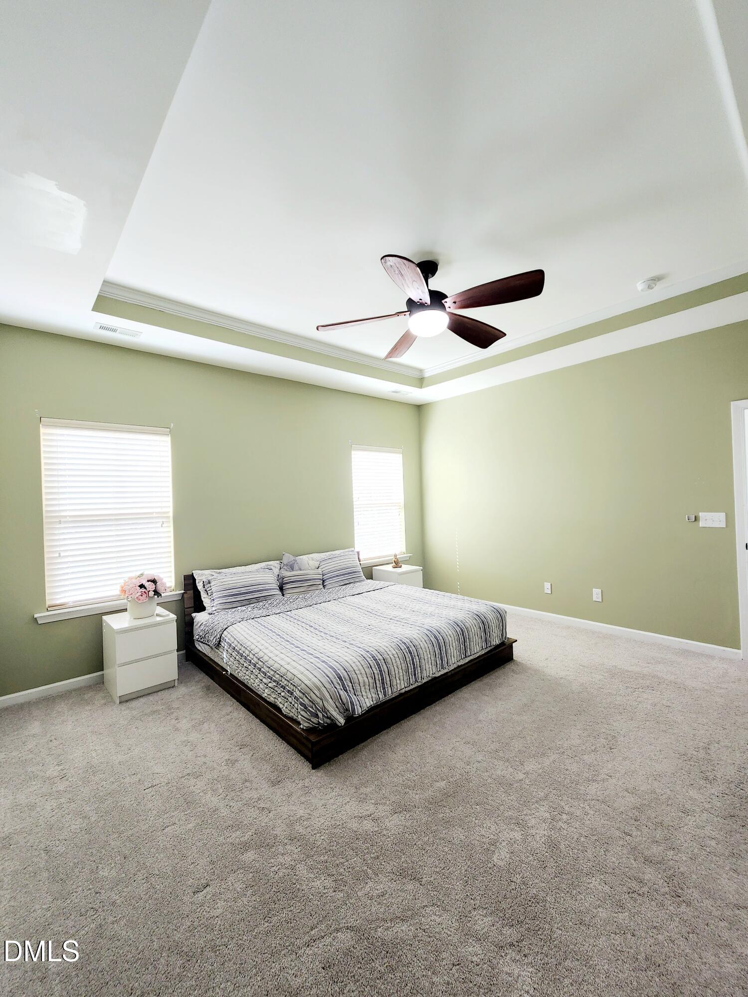 825 Wickham Ridge Road Apex, NC 27539 - Photo 17 of 31 a bedroom with a bed and window