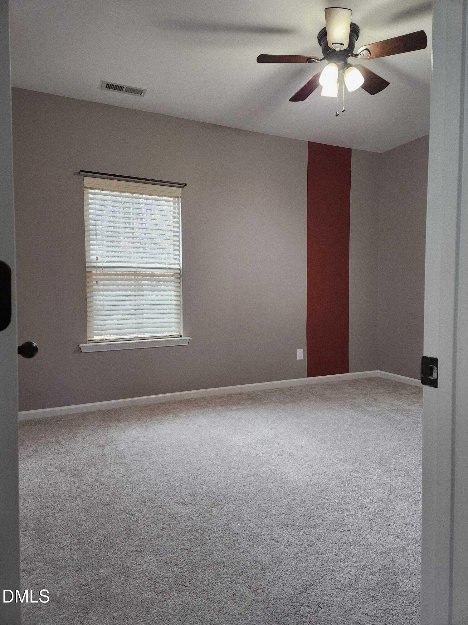 825 Wickham Ridge Road Apex, NC 27539 - Photo 24 of 31 a view of an empty room with a window