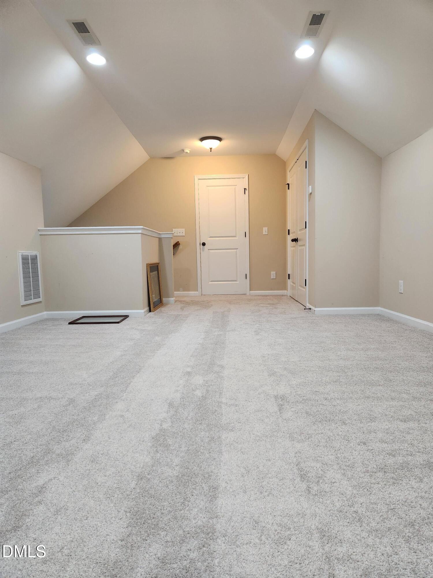 825 Wickham Ridge Road Apex, NC 27539 - Photo 29 of 31 a view of an empty room