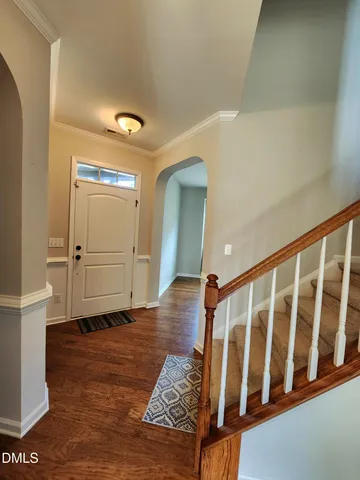 a view of entryway with wooden floor