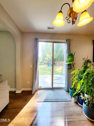 a view of entryway with wooden floor