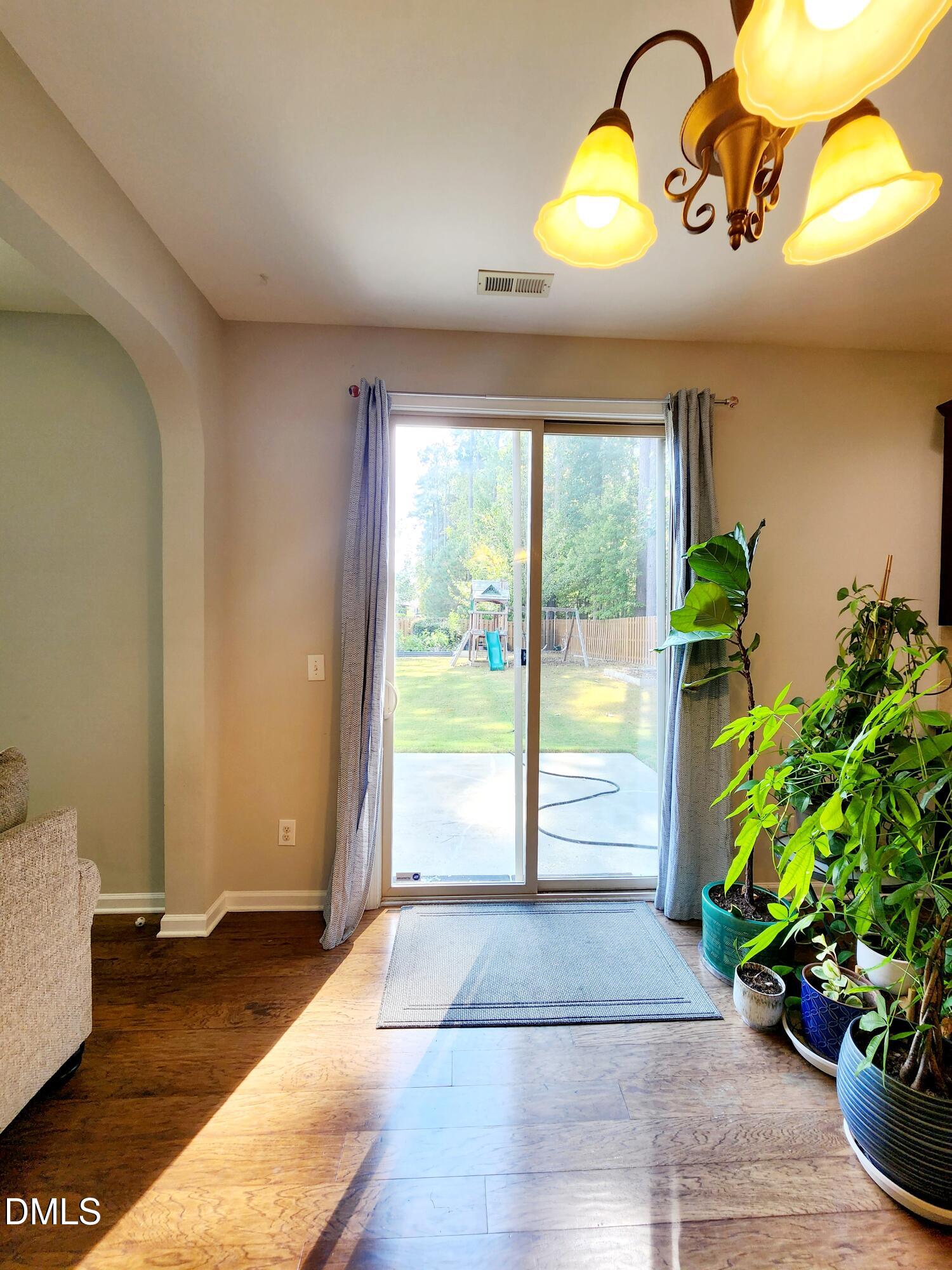 825 Wickham Ridge Road Apex, NC 27539 - Photo 10 of 31 a view of entryway with wooden floor