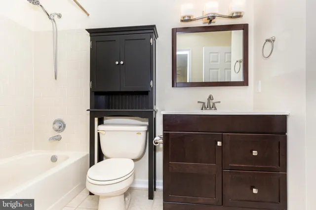 a bathroom with a toilet a sink and bathtub