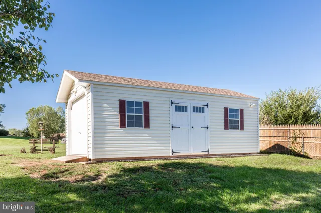 a house view with a sitting space and garden