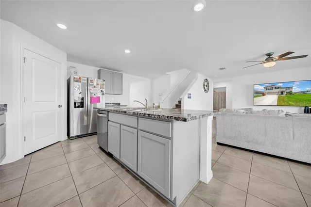 a kitchen with cabinets and window