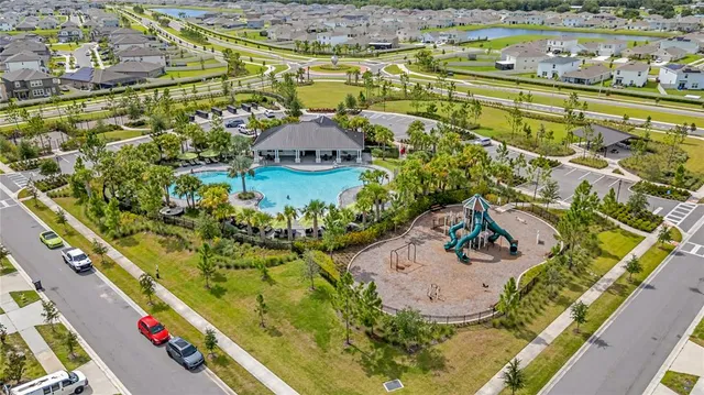 an aerial view of residential houses with outdoor space