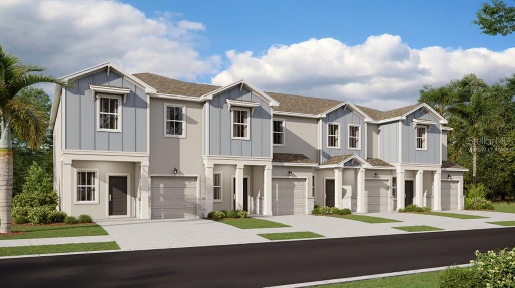 3088 Chromatic Street Kissimmee, FL 34758 - Photo 1 of 21 a front view of a building with a garden
