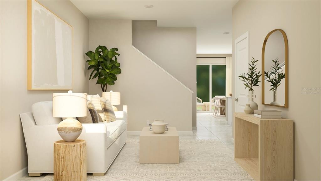 3088 Chromatic Street Kissimmee, FL 34758 - Photo 6 of 21 a living room with furniture and a potted plant