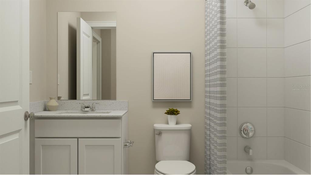 3088 Chromatic Street Kissimmee, FL 34758 - Photo 7 of 21 a bathroom with a sink toilet and mirror
