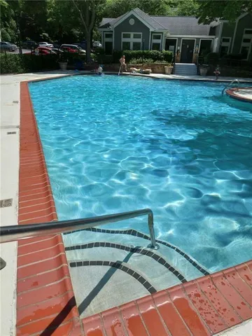 a room with gym equipment and floor to ceiling window