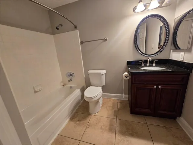 a bathroom with a toilet a sink and bathtub