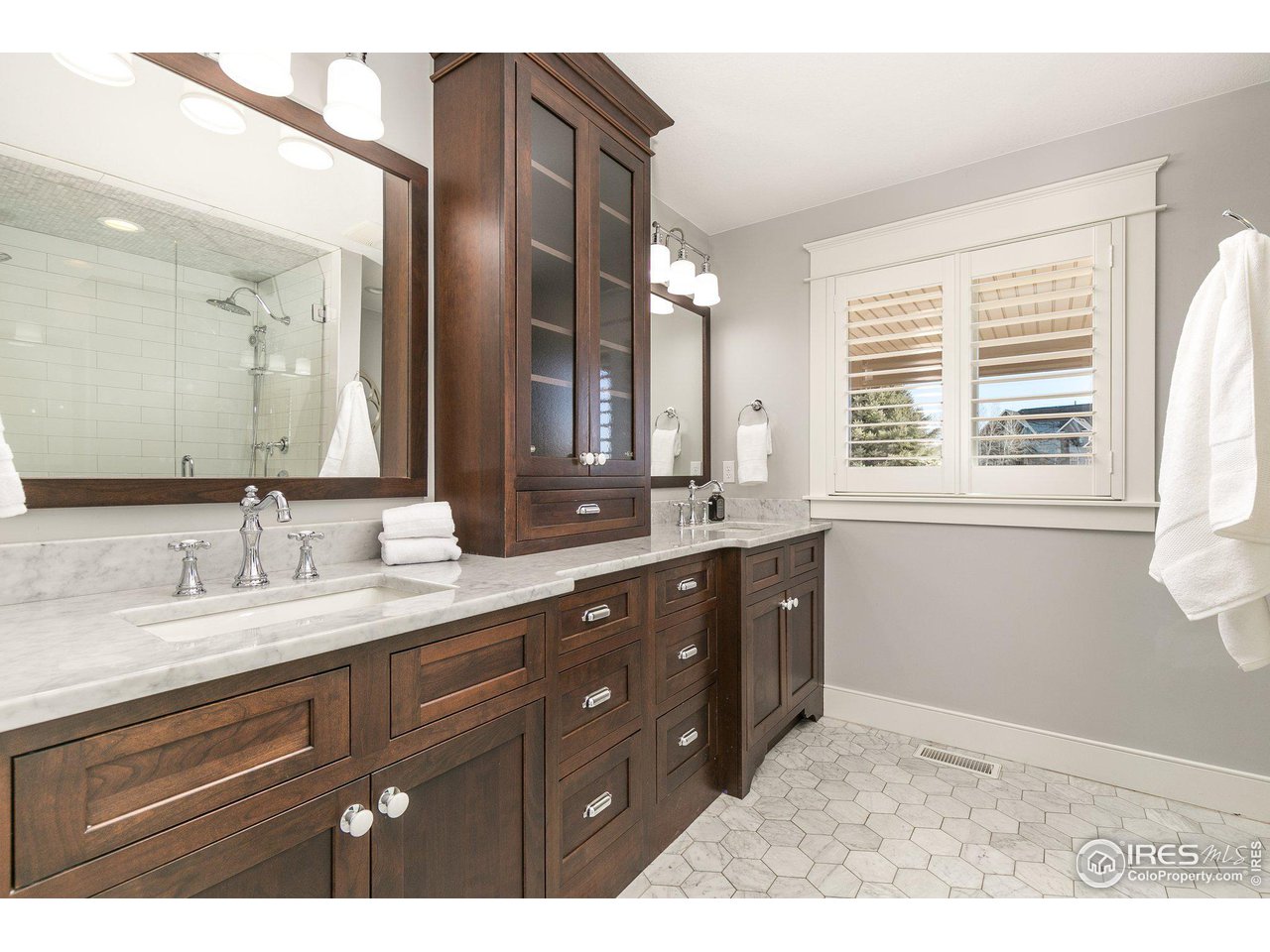 39337 Rangeview Drive Severance, CO 80610 - Photo 19 of 40 a bathroom with a granite countertop sink mirror and double