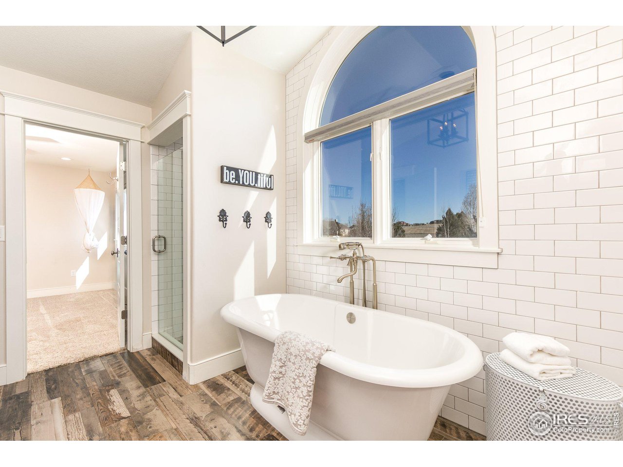 39337 Rangeview Drive Severance, CO 80610 - Photo 20 of 40 a bathroom with a sink a toilet and shower