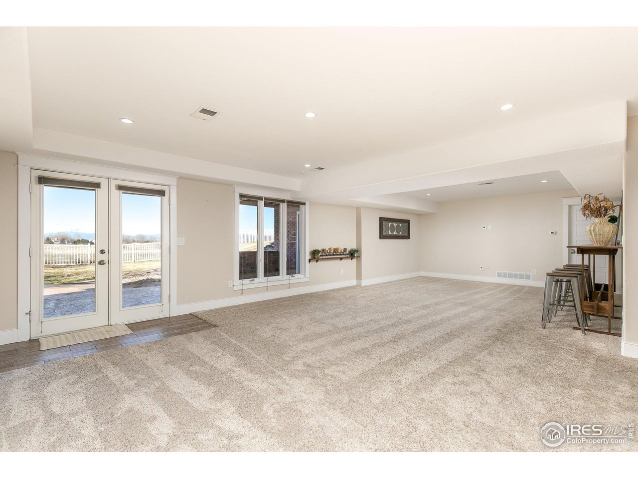 39337 Rangeview Drive Severance, CO 80610 - Photo 25 of 40 a view of an empty room with glass door