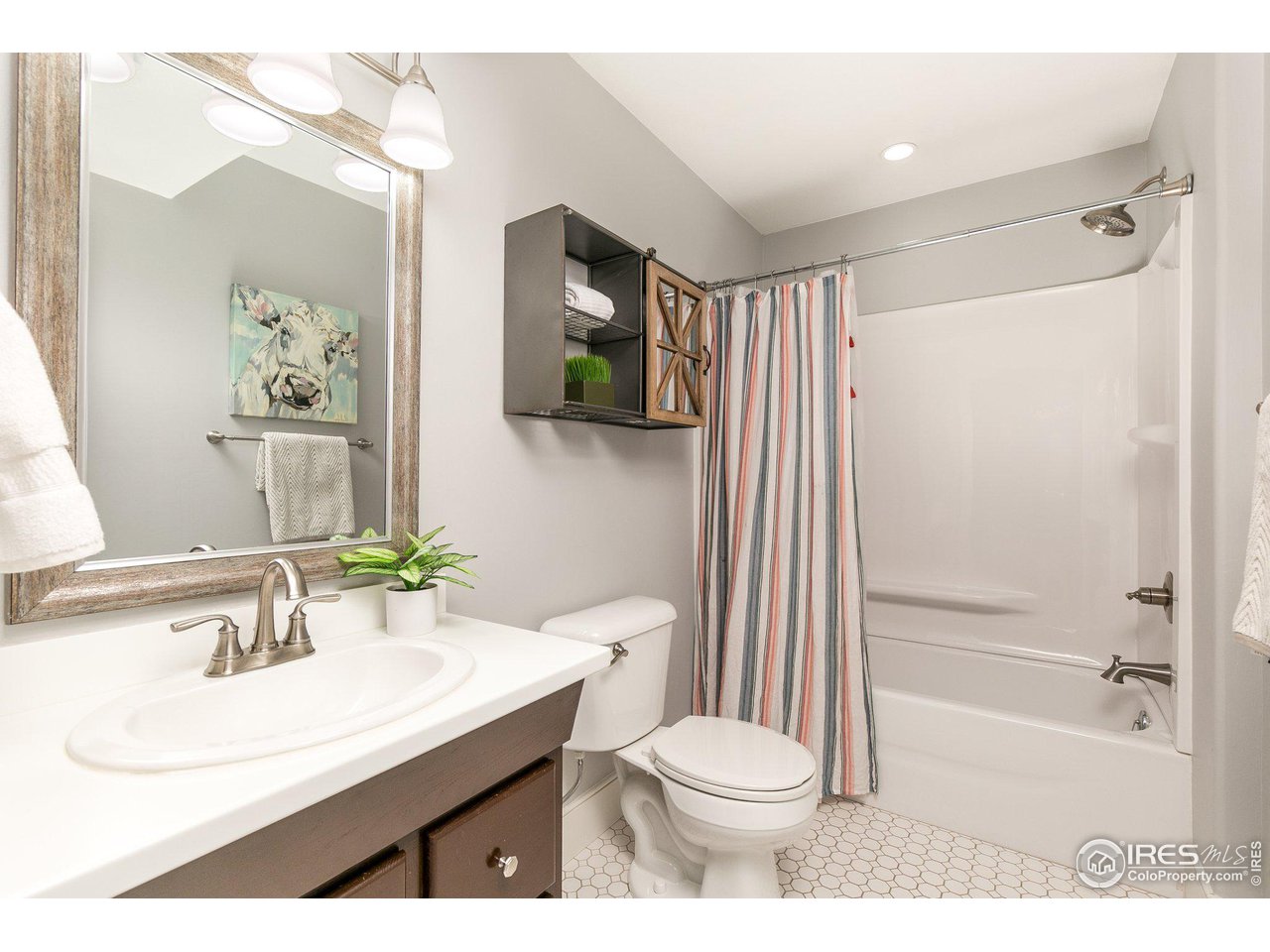 39337 Rangeview Drive Severance, CO 80610 - Photo 28 of 40 a bathroom with a sink a toilet and shower