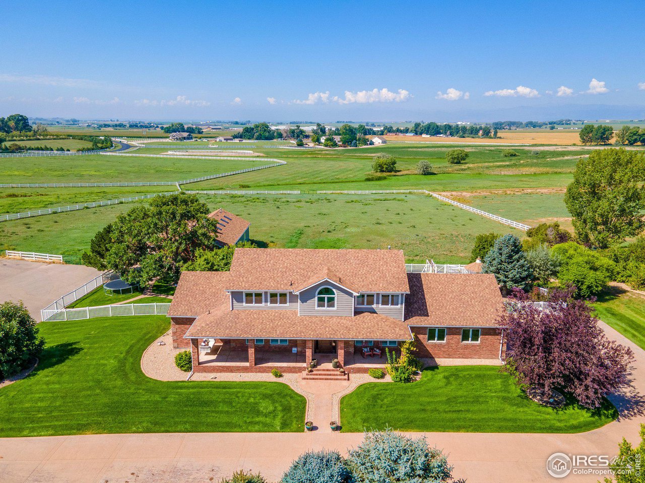 39337 Rangeview Drive Severance, CO 80610 - Photo 3 of 40 a aerial view of a house with big yard and large trees