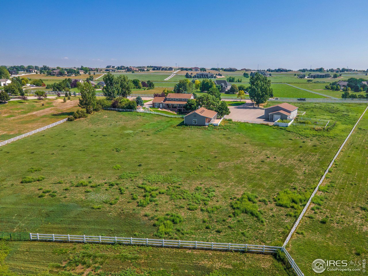 39337 Rangeview Drive Severance, CO 80610 - Photo 40 of 40 a backyard of a house with lots of green space and mountain view in back