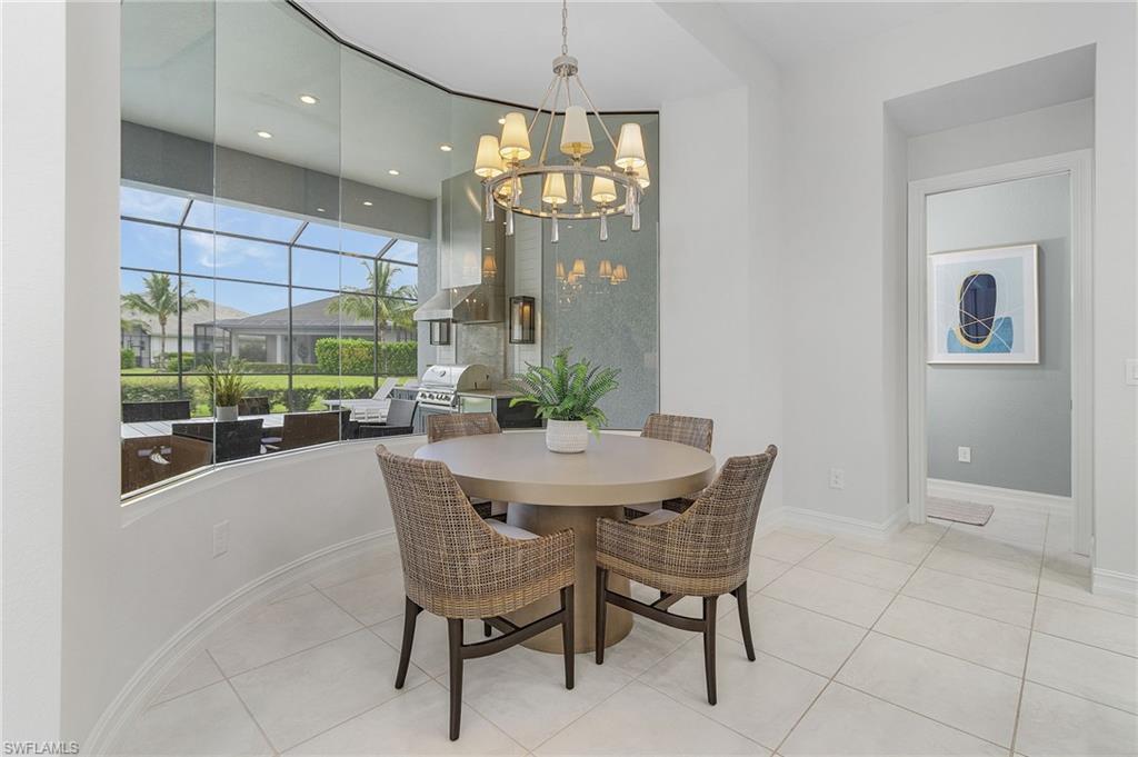 14226 Charthouse Circle Naples, FL 34114 - Photo 22 of 46 a dining room with furniture and window