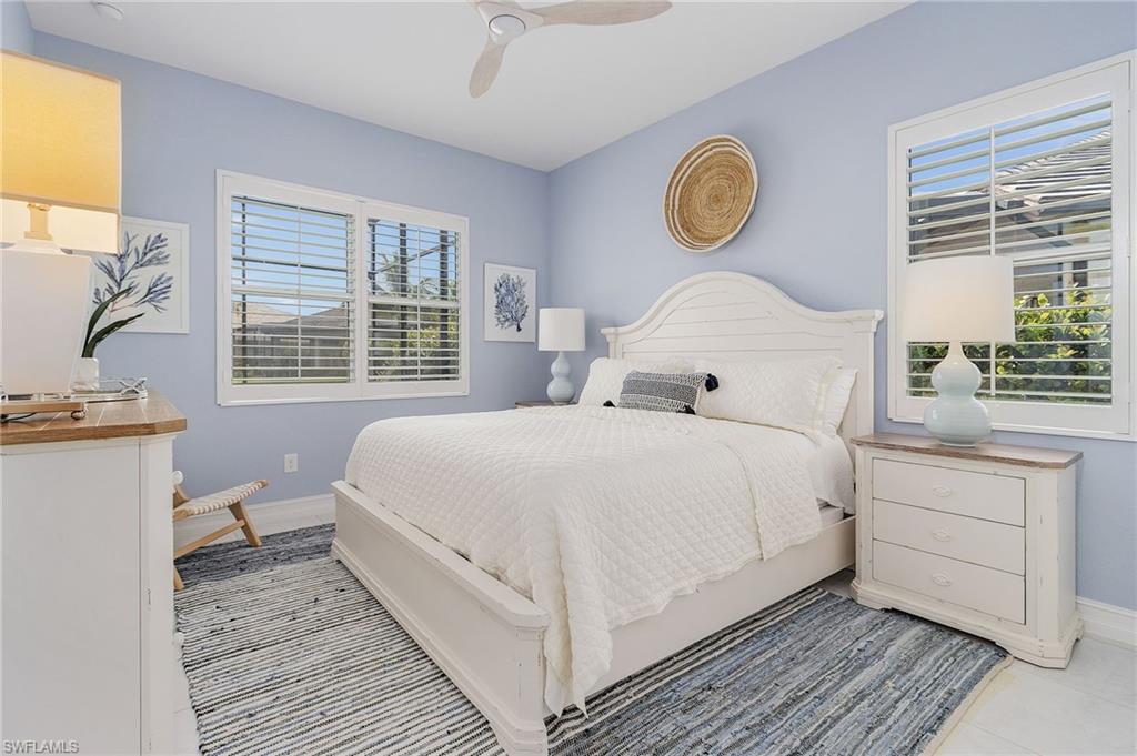 14226 Charthouse Circle Naples, FL 34114 - Photo 26 of 46 a bed room with a bed and a window