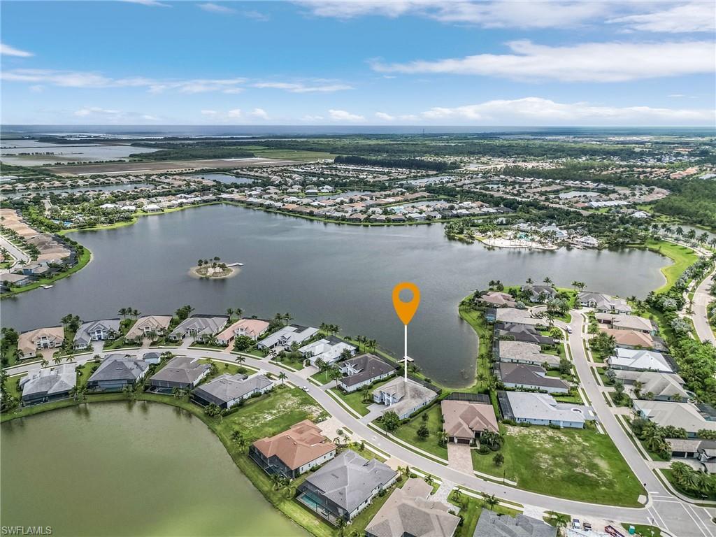 14226 Charthouse Circle Naples, FL 34114 - Photo 3 of 46 an aerial view of a house with a lake view