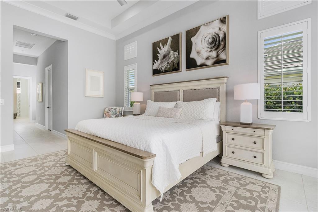 14226 Charthouse Circle Naples, FL 34114 - Photo 34 of 46 a bedroom with a bed and a window