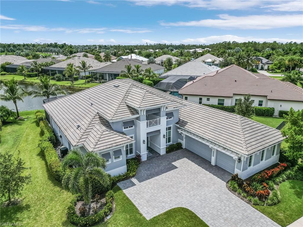14226 Charthouse Circle Naples, FL 34114 - Photo 6 of 46 a view of a house with a yard and sitting area
