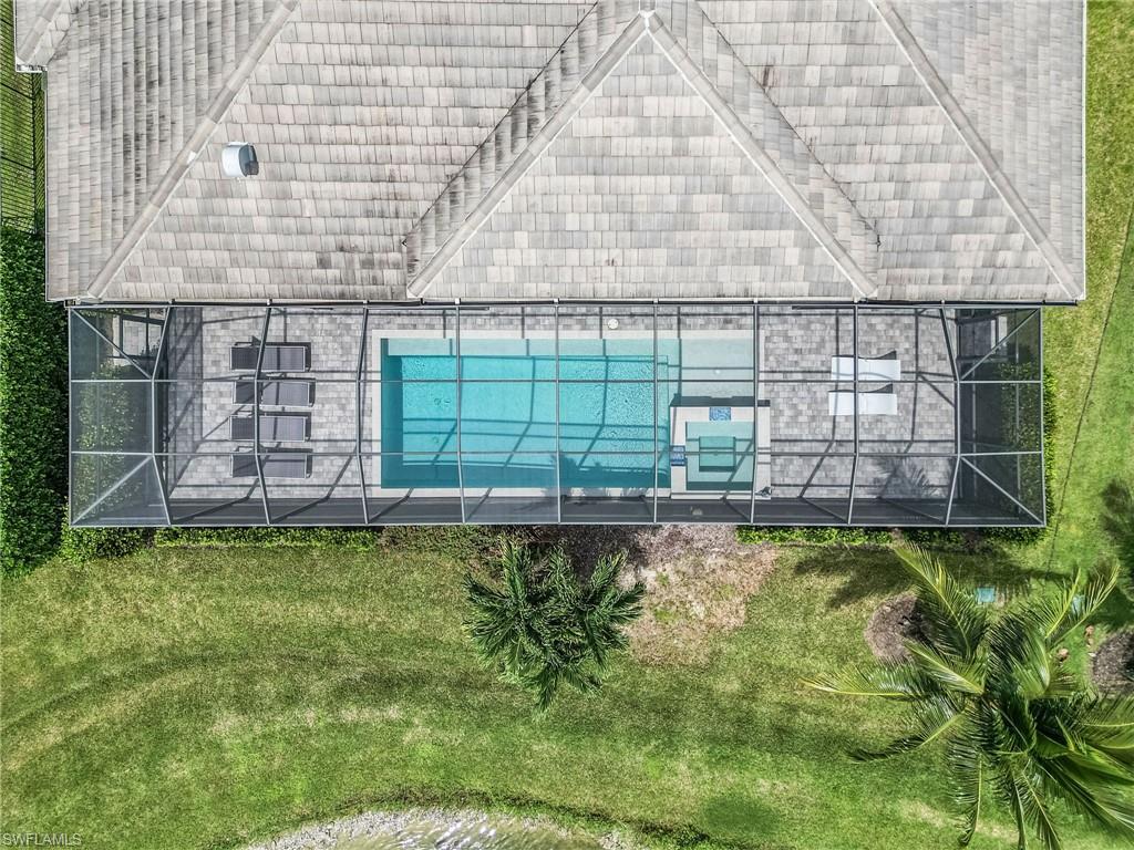 14226 Charthouse Circle Naples, FL 34114 - Photo 10 of 46 a swimming pool with outdoor space