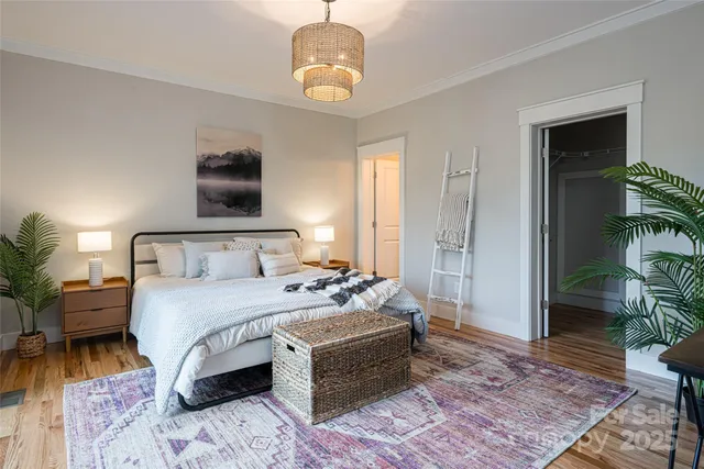 a bedroom with bed and a couch