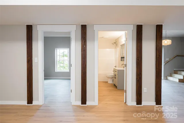 a view of a bathroom from a hallway