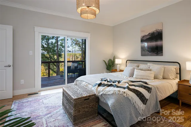 a bedroom with a large bed and a window