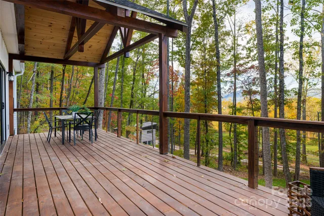 a view of balcony with wooden floor