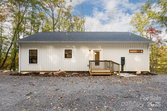 a house with trees in the background