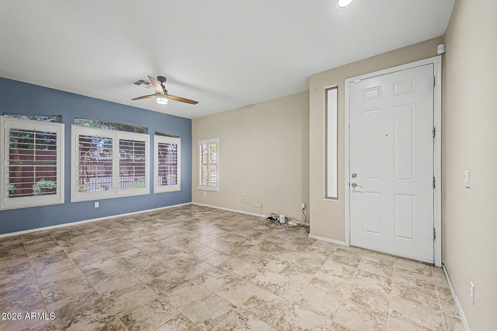 2600 East Springfield Place, Unit 109 Chandler, AZ 85286 - Photo 5 of 38 a view of an empty room with a window