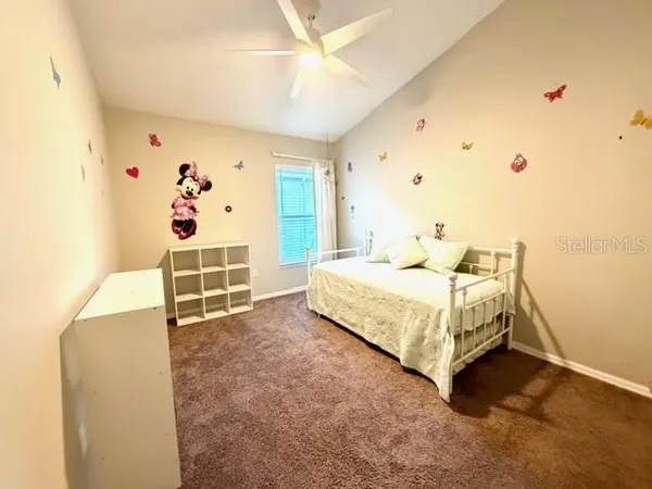 a bedroom with a bed and a cabinets