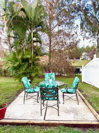 a view of outdoor sitting area with furniture and garden