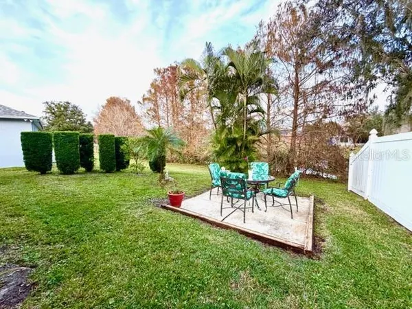 a view of a table and chairs in the garden