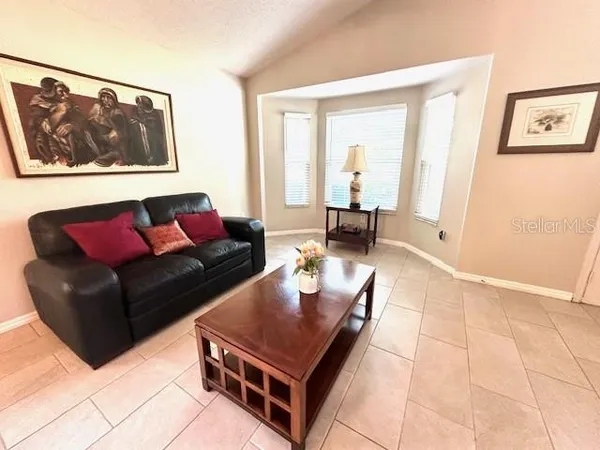 a living room with furniture and a black door