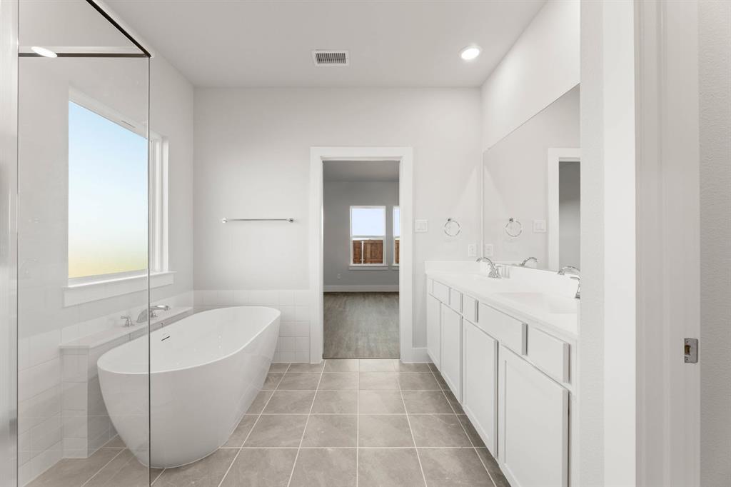 1504 Blackthorne Lane Krum, TX 76249 - Photo 15 of 30 a bathroom with a bathtub and a sink